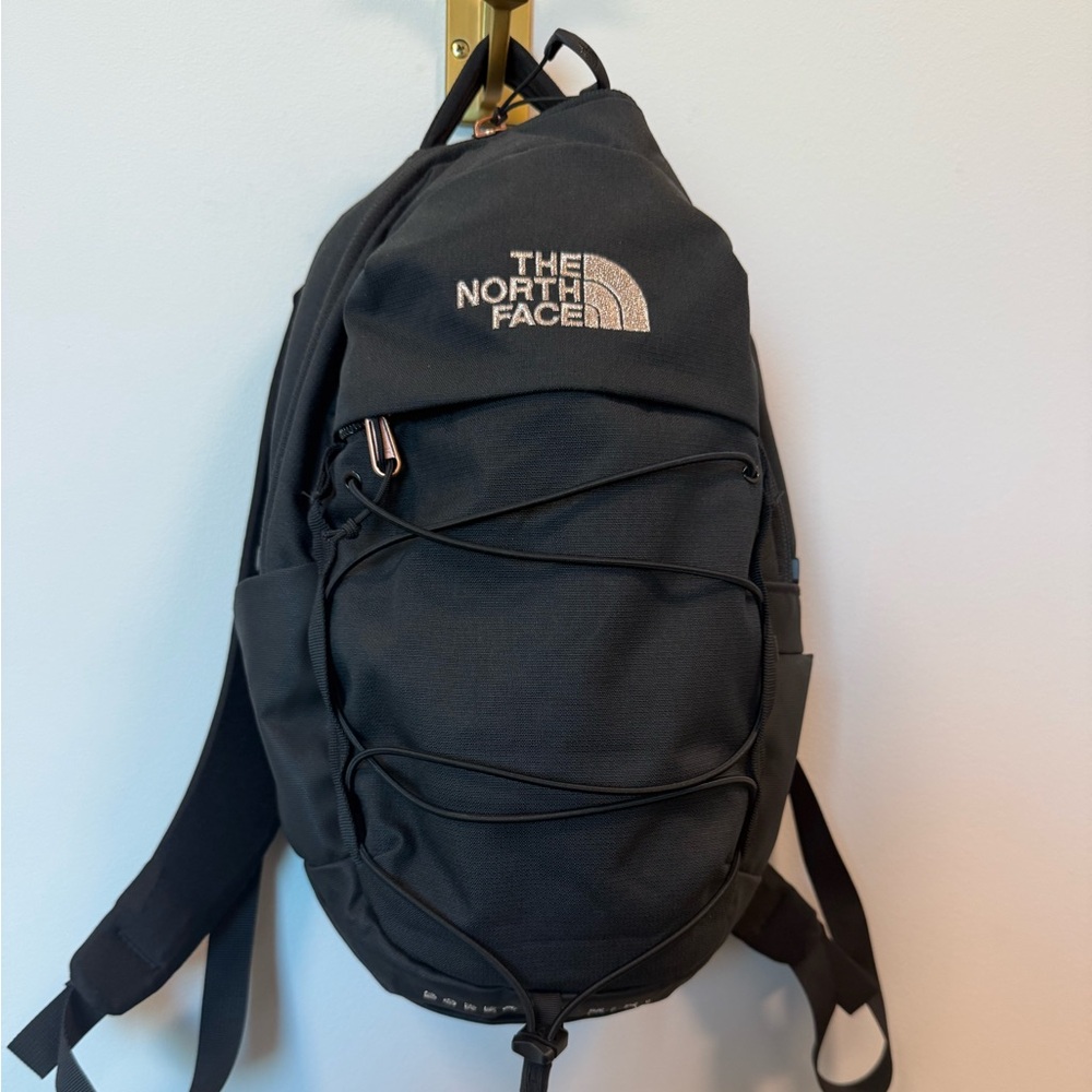 The North Face Black and bronze Backpack